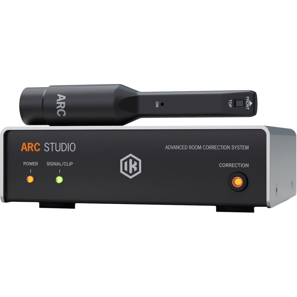 IK Multimedia ARC Studio room calibration device connected to audio equipment, demonstrating sound optimization setup.
