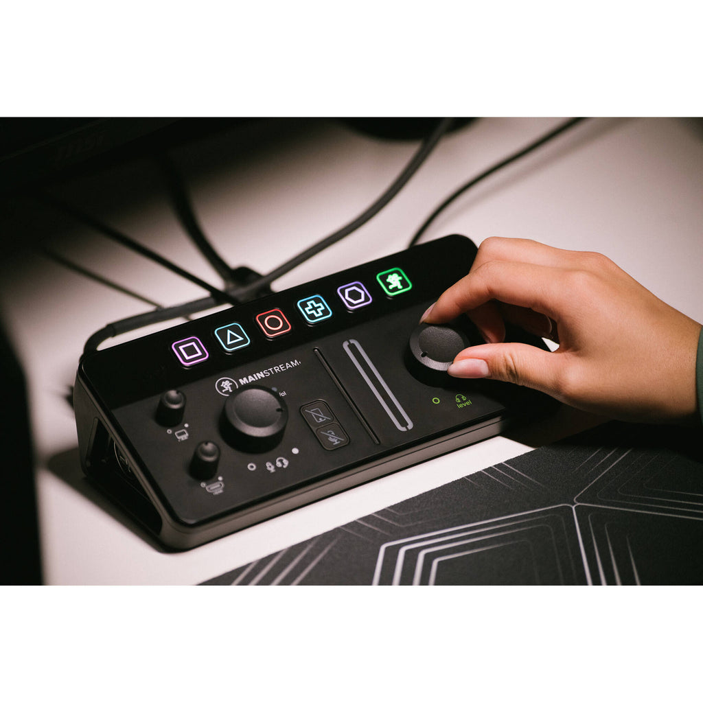 Mackie MainStream video streaming device with control interface, featuring buttons and display screen for live streaming setup.