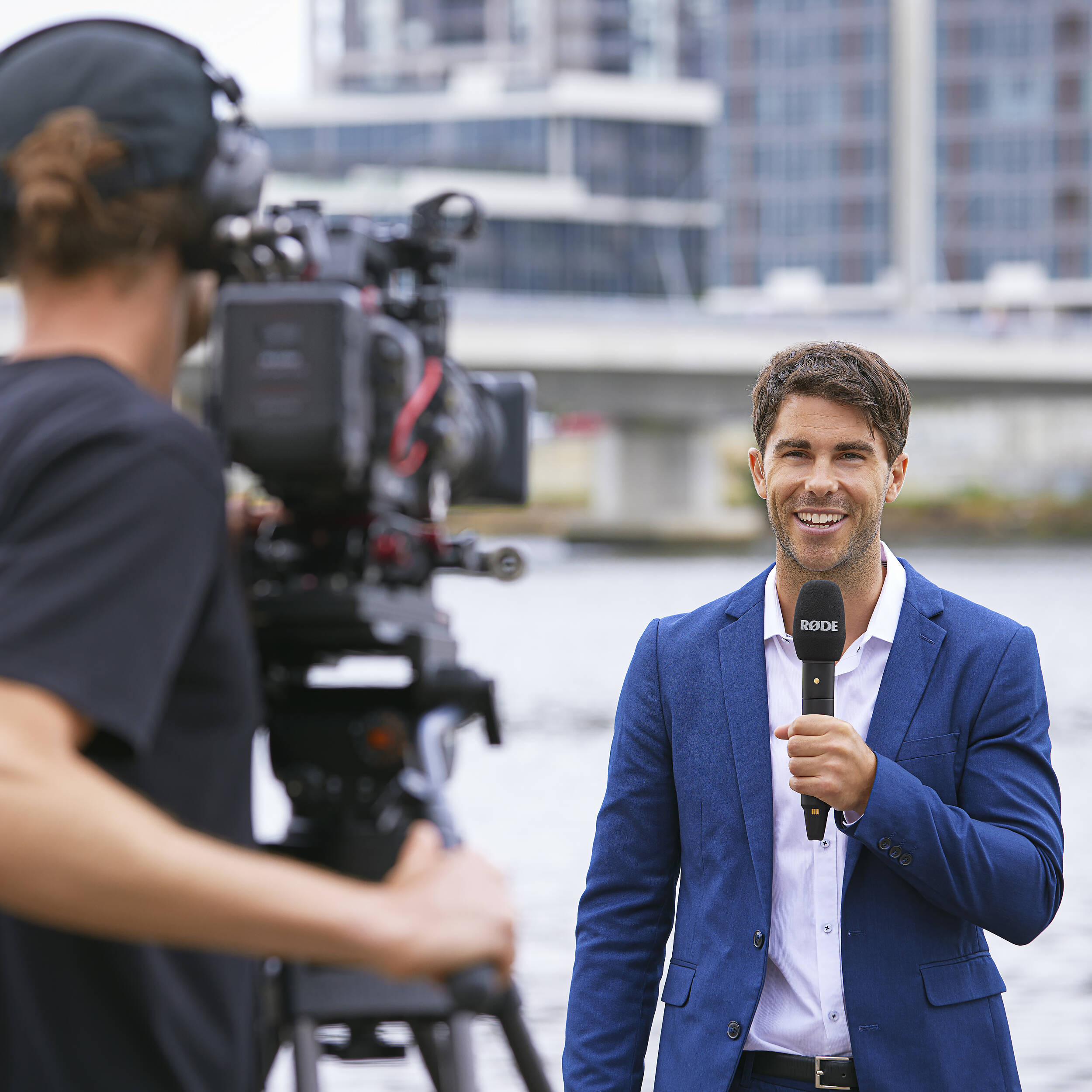 Rode Interview Pro wireless microphone accessory with microphone clip and transmitter in black, used for professional audio recording.