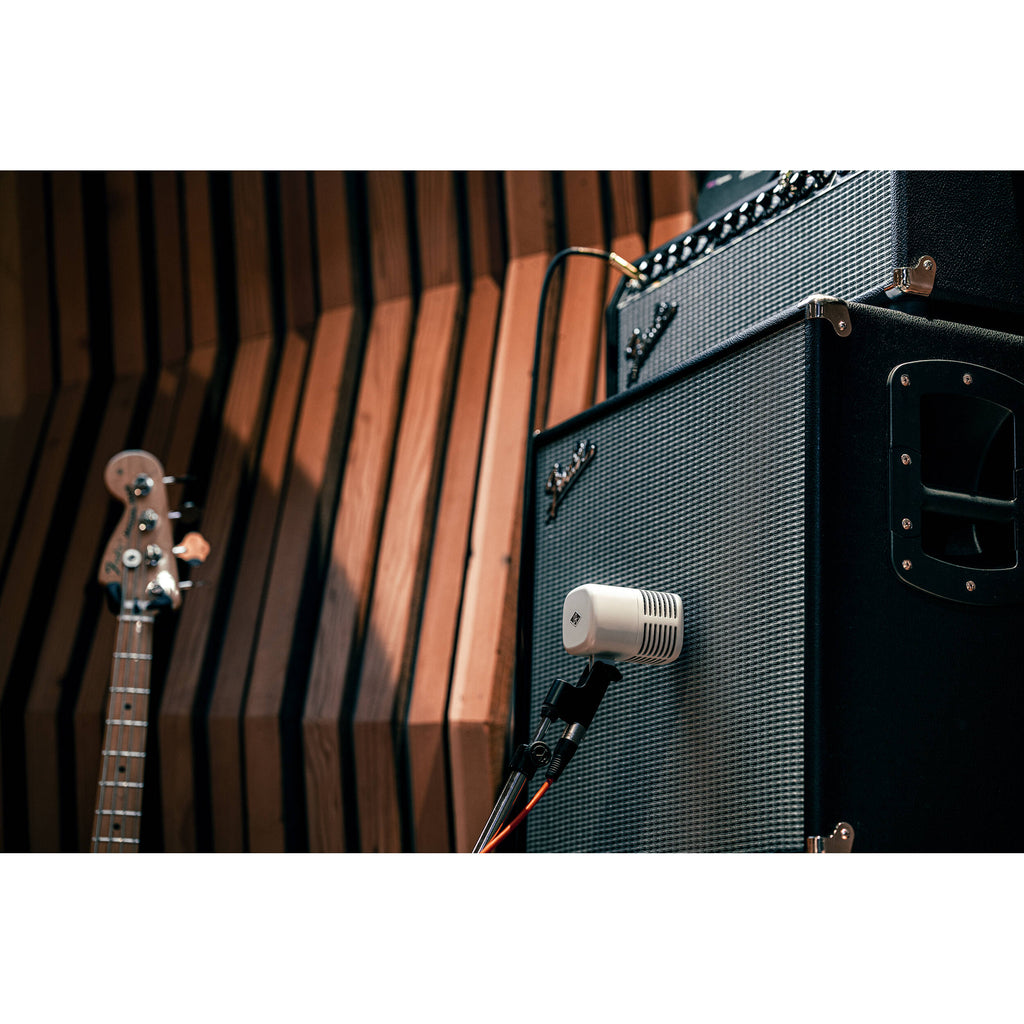 Universal Audio SD-5 dynamic microphone shown with a sleek design and sturdy grille for professional audio recording.