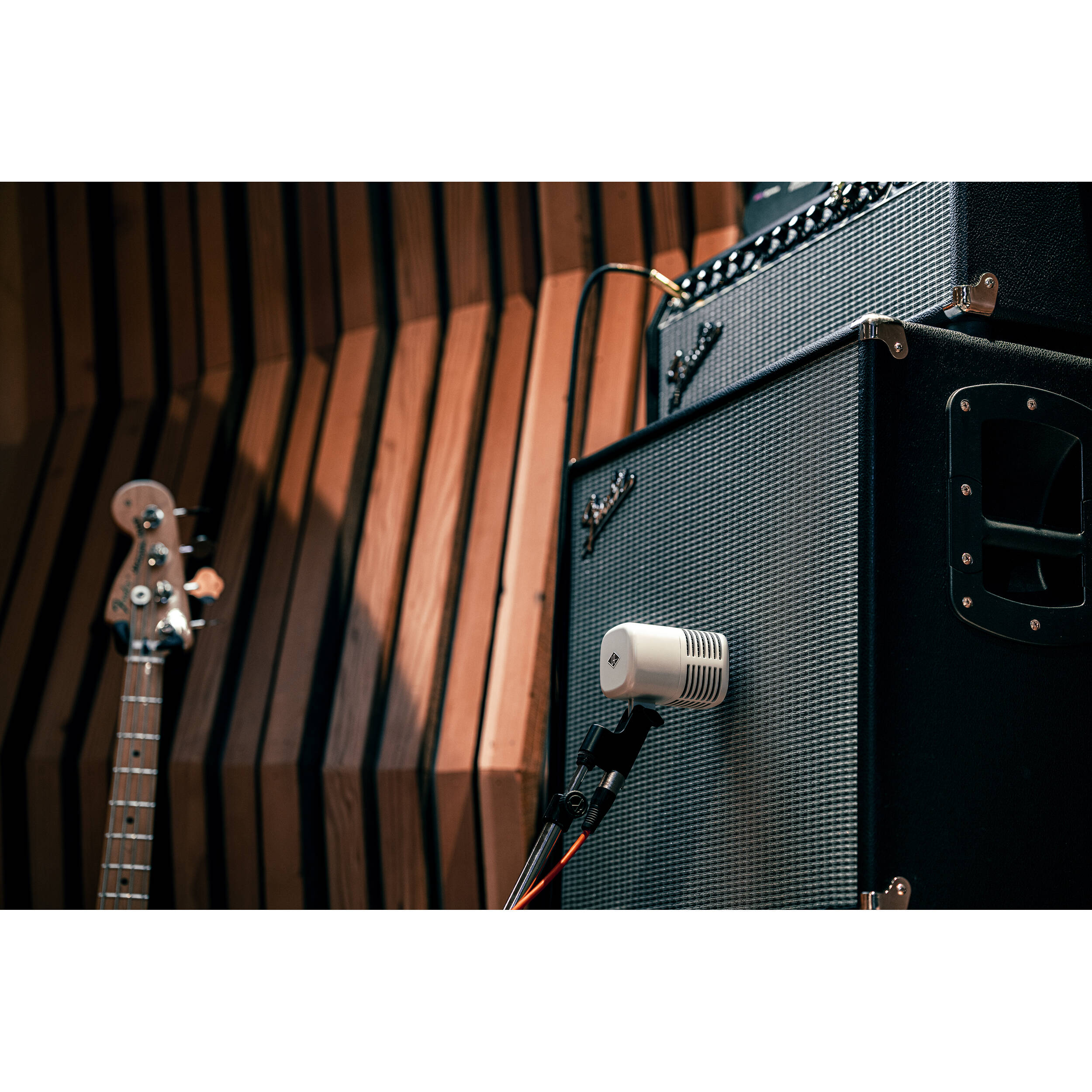 Universal Audio SD-5 dynamic microphone shown with a sleek design and sturdy grille for professional audio recording.
