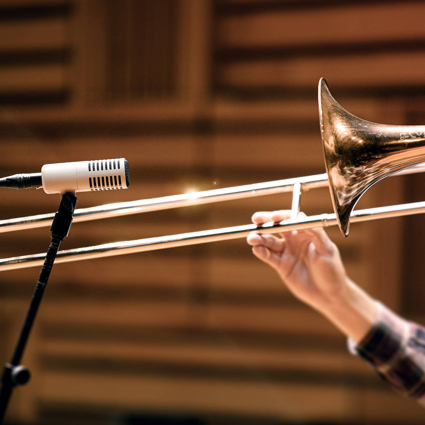 Universal Audio SD-7 dynamic microphone positioned on a stand, showcasing its sleek design and professional audio equipment quality.