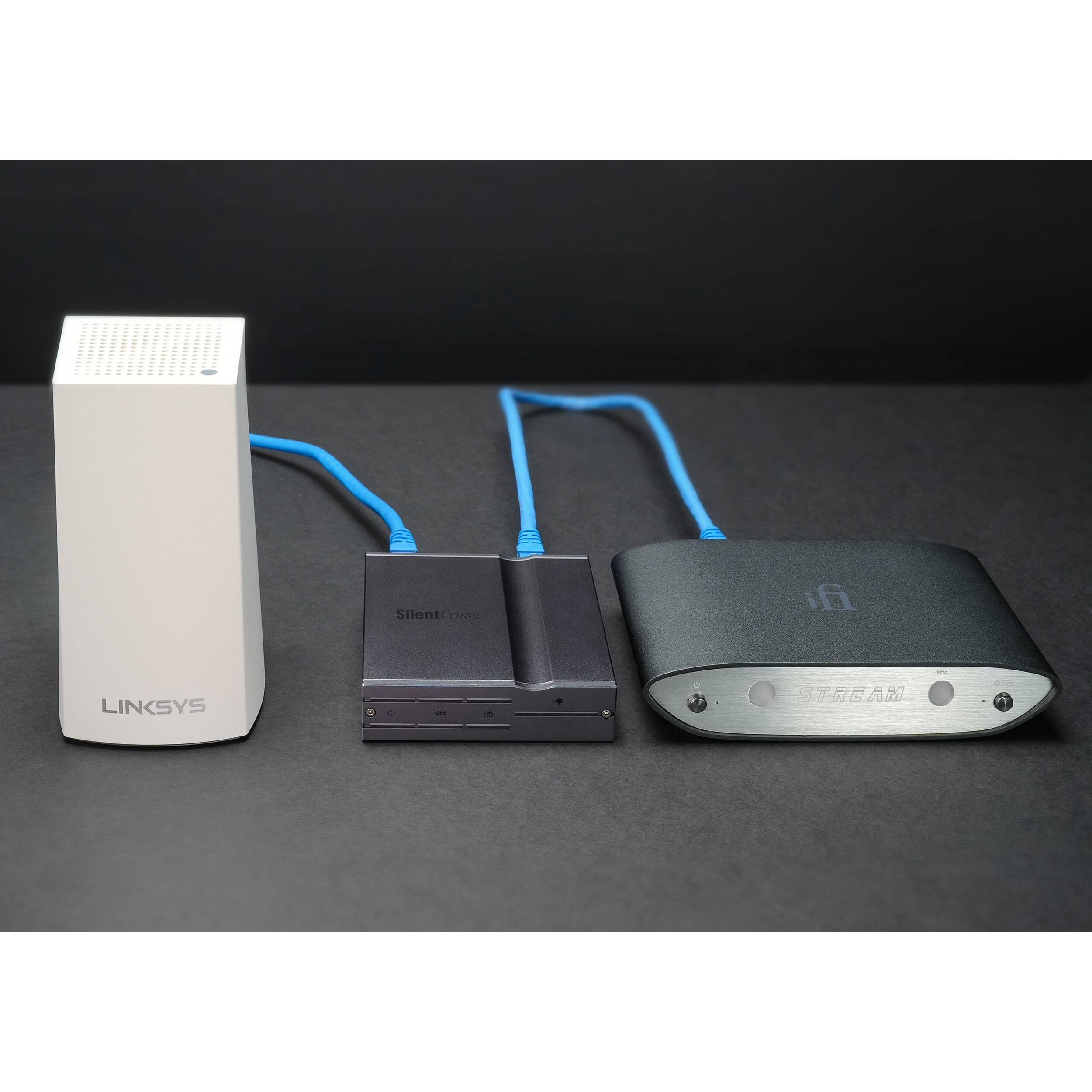 SilentPower LAN iPurifier Pro noise filter and conditioner, featuring a sleek design and cables connected for optimal performance.