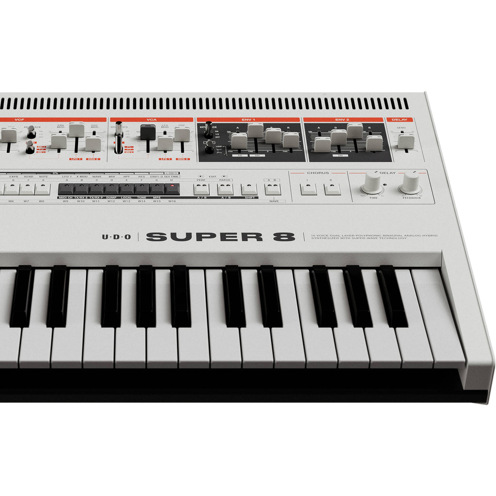 UDO Audio Super 8 synthesizer with multiple control knobs and vintage-style design, showcasing its front panel and keyboard.