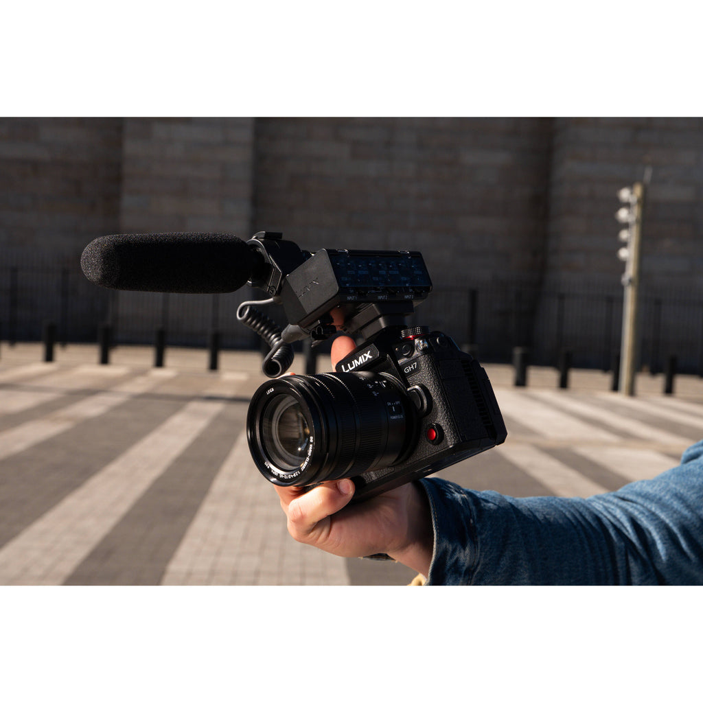 Panasonic Lumix GH7 mirrorless camera with 12-60mm F/2.8-4 lens, showcasing the camera body and attached zoom lens.