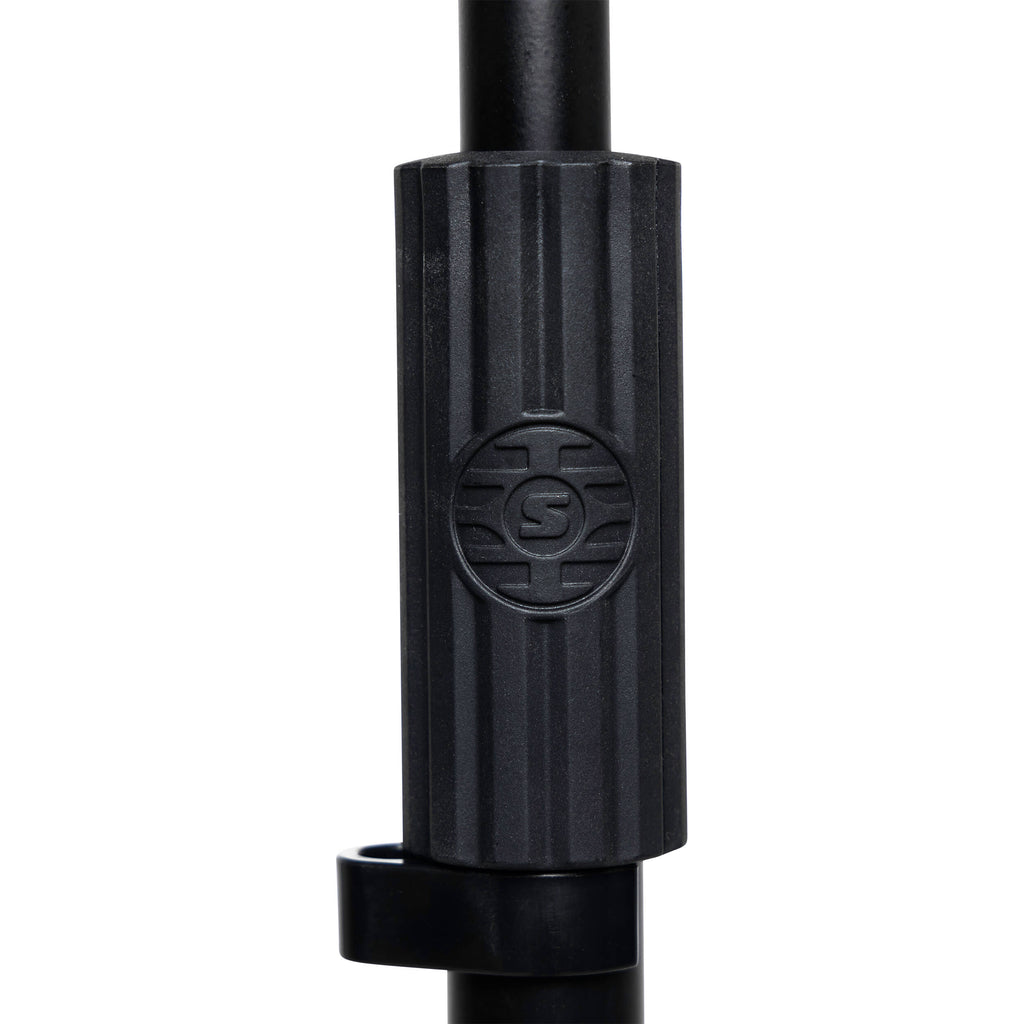 Shure floor microphone stand with adjustable height and sturdy base, designed for professional audio recording and live performances.