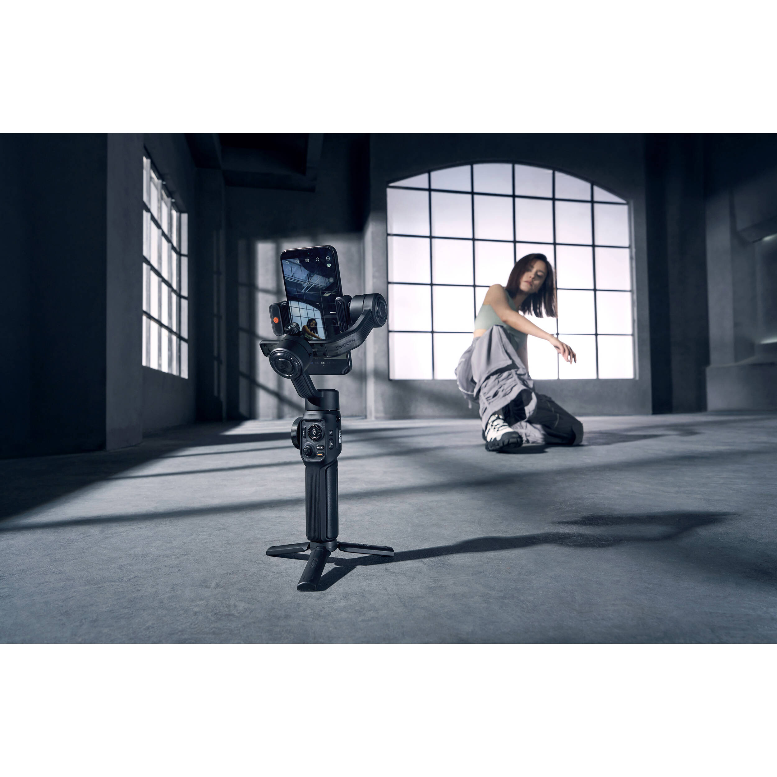 Zhiyun Smooth 5S AI handheld gimbal stabilizer for video recording, featuring sleek design and control buttons.