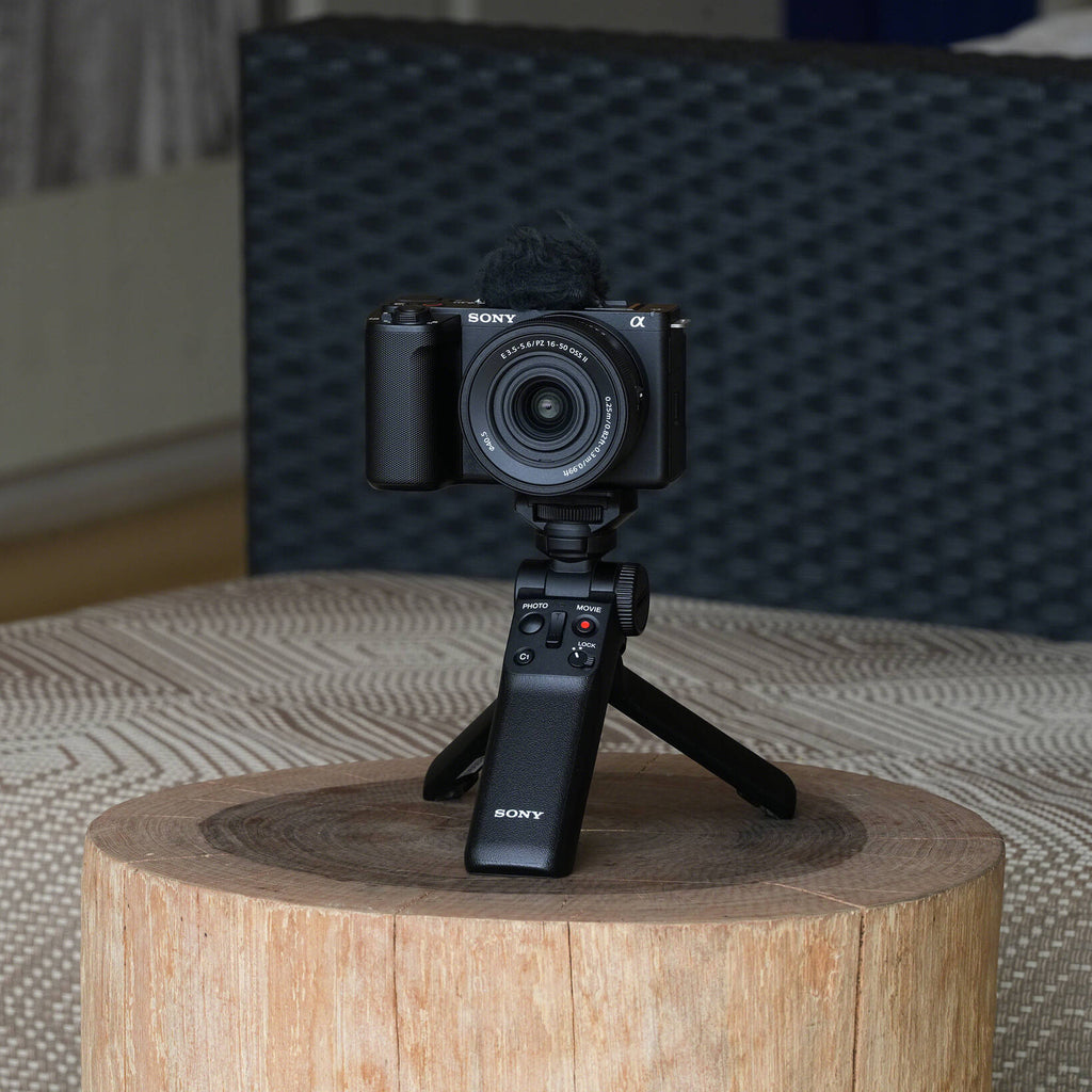 Sony ZV-E10 II mirrorless camera with 16-50mm zoom lens, showcasing the compact design and adjustable lens in a professional setup.