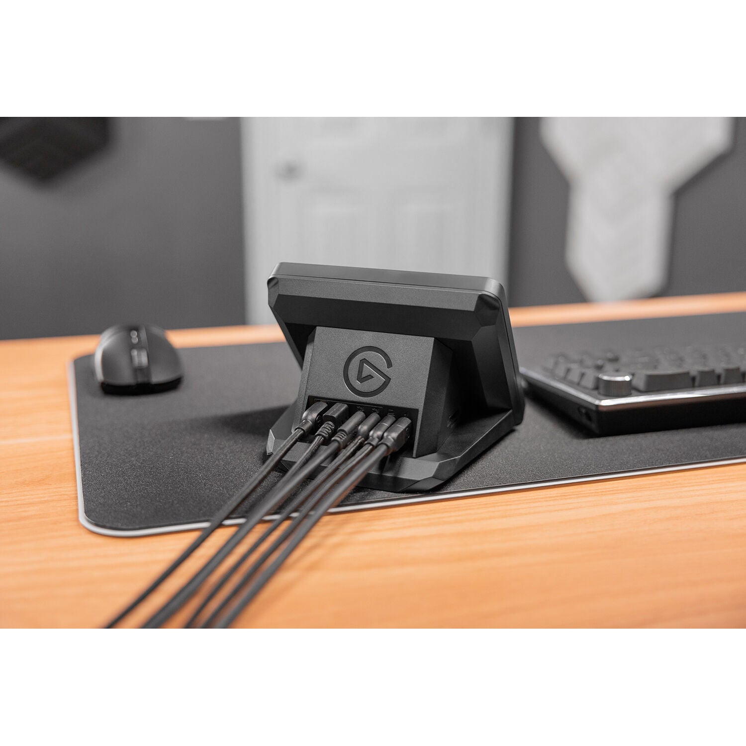 Elgato USB hub for Stream Deck+ with multiple ports, compact design, and sleek black finish for connecting video and streaming devices.