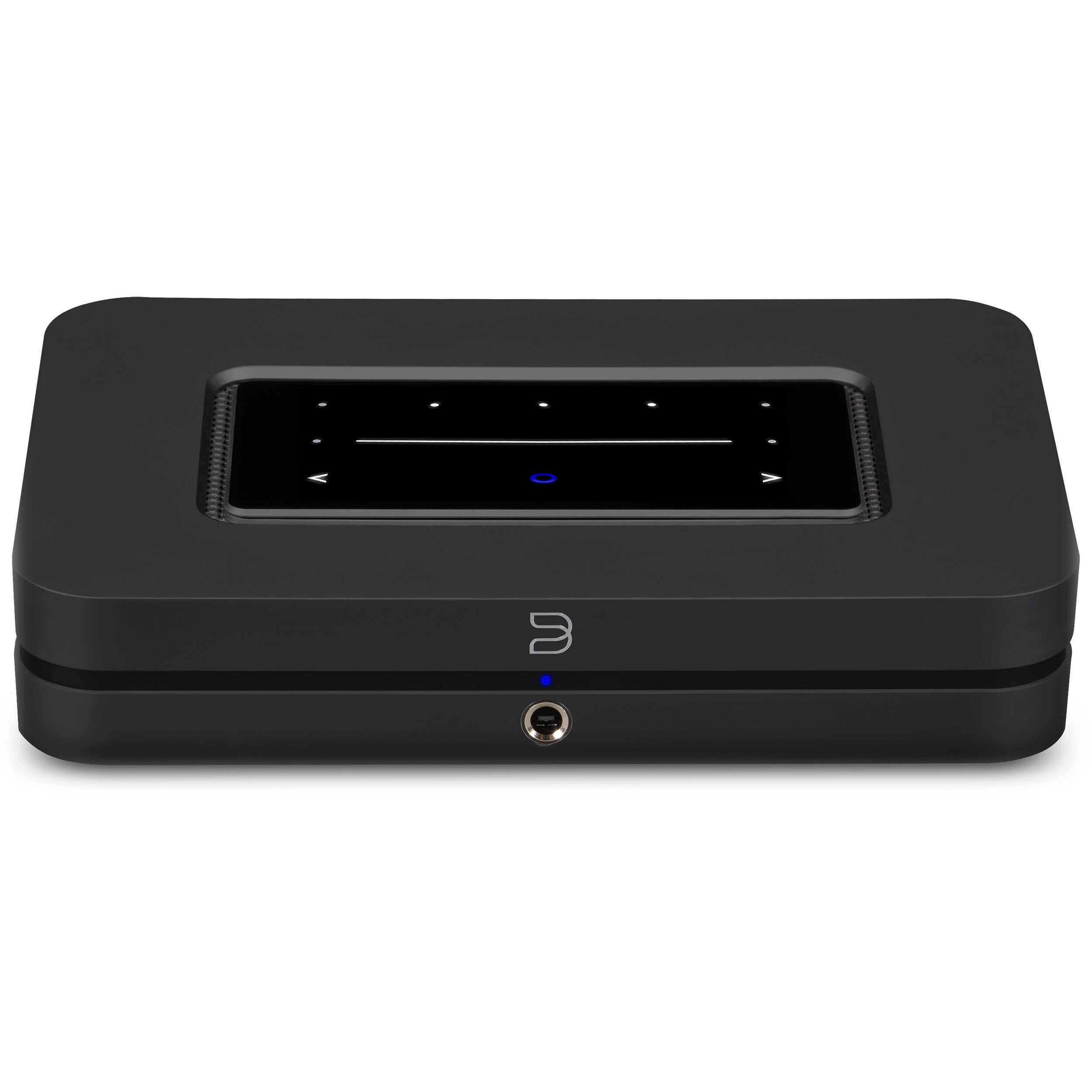 Bluesound Node 2025 black music streamer connected to audio equipment, showing sleek compact design and front display panel.