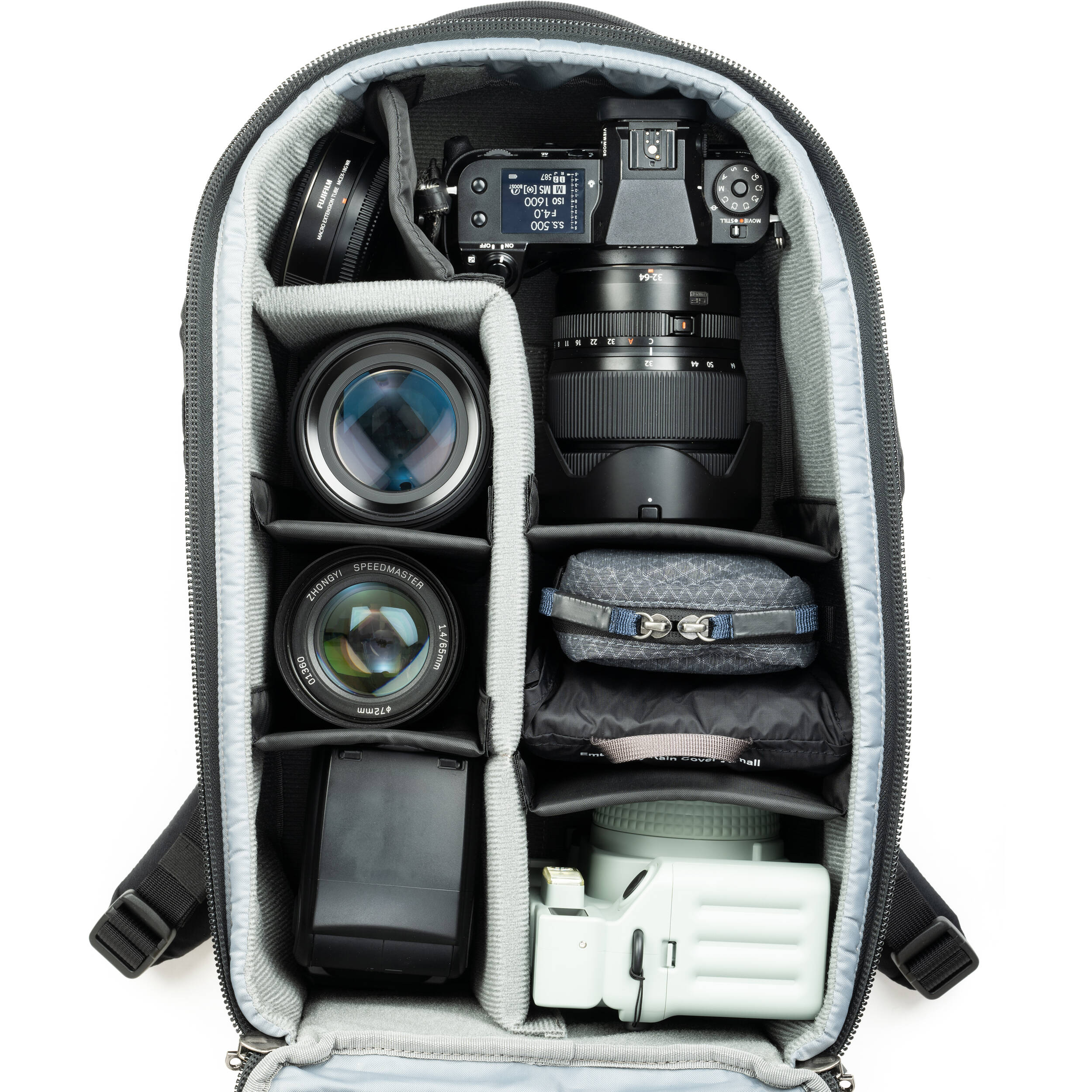 Think Tank Walker Pro Series backpack with padded compartments for video equipment, black durable fabric, and multiple storage pockets.