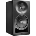 Kali Audio SM-8 active nearfield monitors shown on a desk with audio equipment and cables in a studio setting.