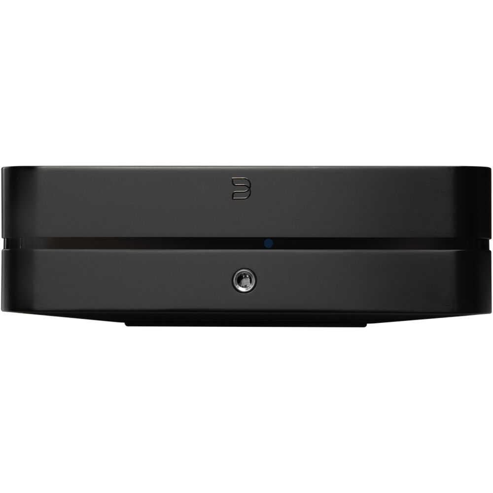 Bluesound Powernode 2025 music streamer with sleek black design and front display, connected to audio equipment.