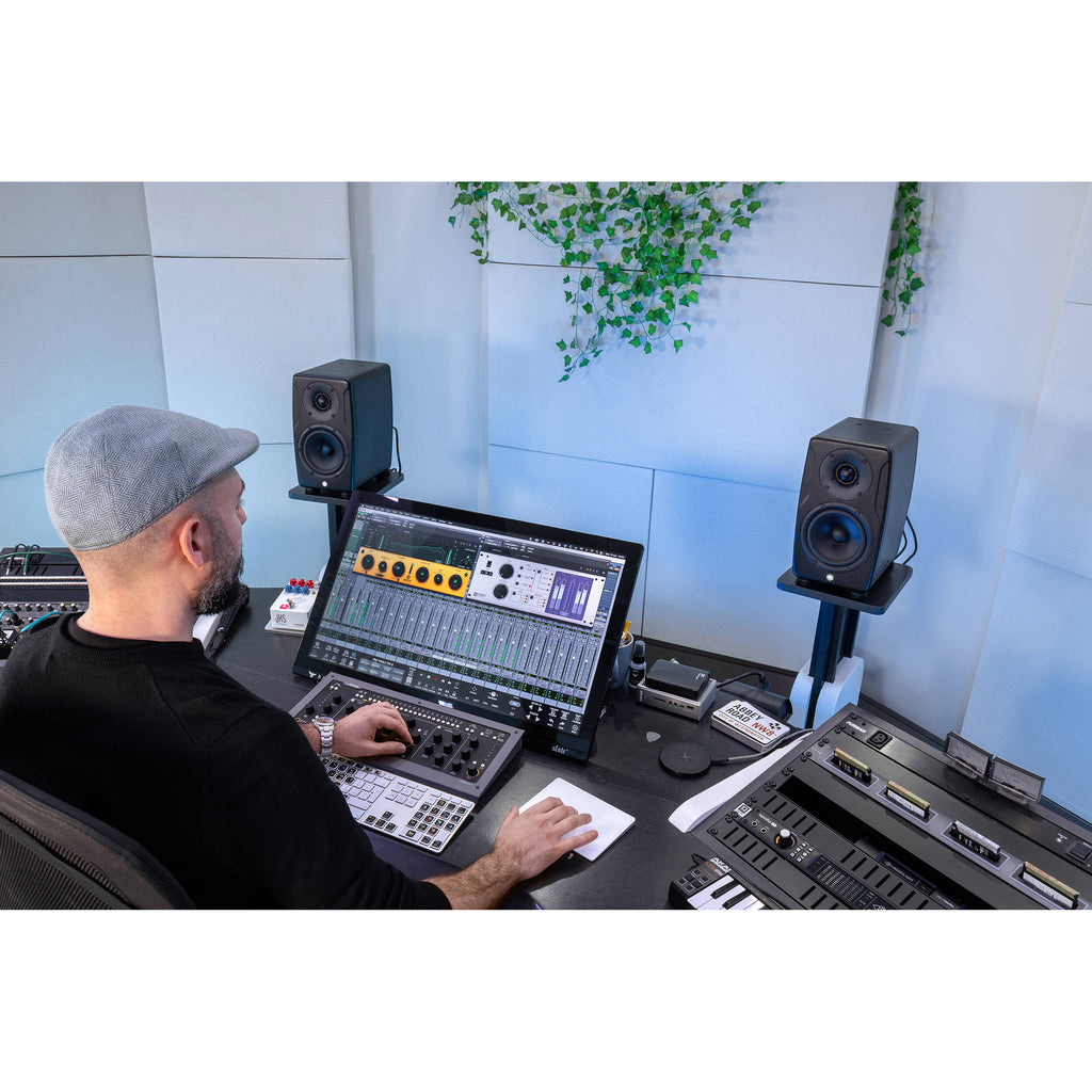 IK Multimedia iLoud Precision 5 MK2 active nearfield monitors shown with sleek black finish and detailed speaker drivers.