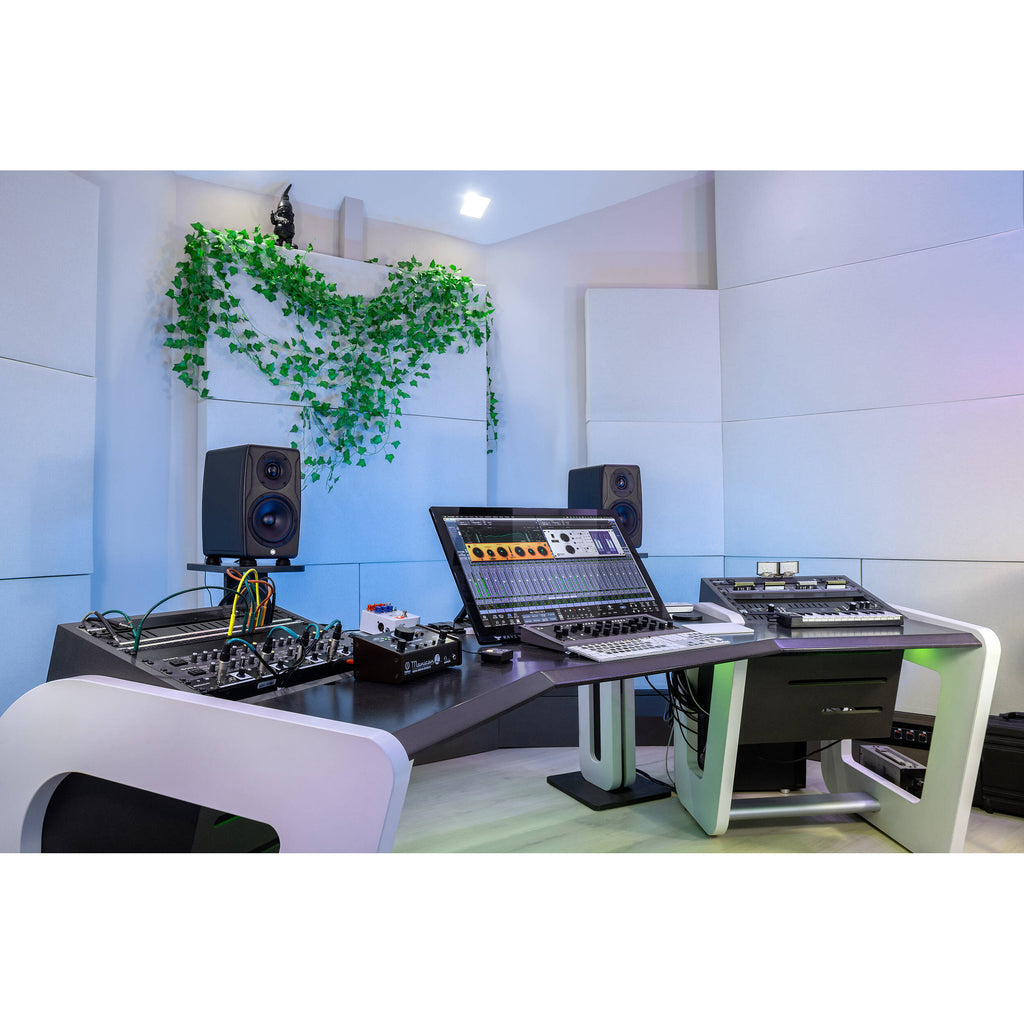 IK Multimedia iLoud Precision 5 MK2 active nearfield monitors with black speaker cabinets and control knobs on the front panel.