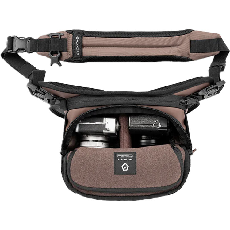 Wandrd Rogue Sling bag for video equipment, black, compact design with adjustable strap and multiple compartments for gear storage.