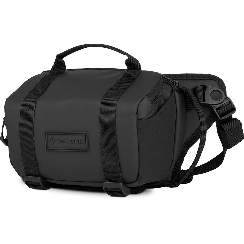 Wandrd Rogue Sling camera bag with adjustable strap and multiple compartments for video equipment storage.