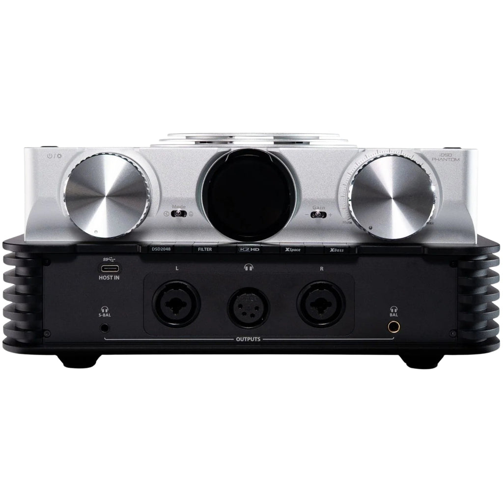iFi Audio iDSD Phantom headphone amplifier and DAC with digital and analog inputs, compact black audio device on a desk