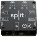 OXI Instruments Split 2 MIDI interface with multiple input/output ports and compact design, used for music production and MIDI control.