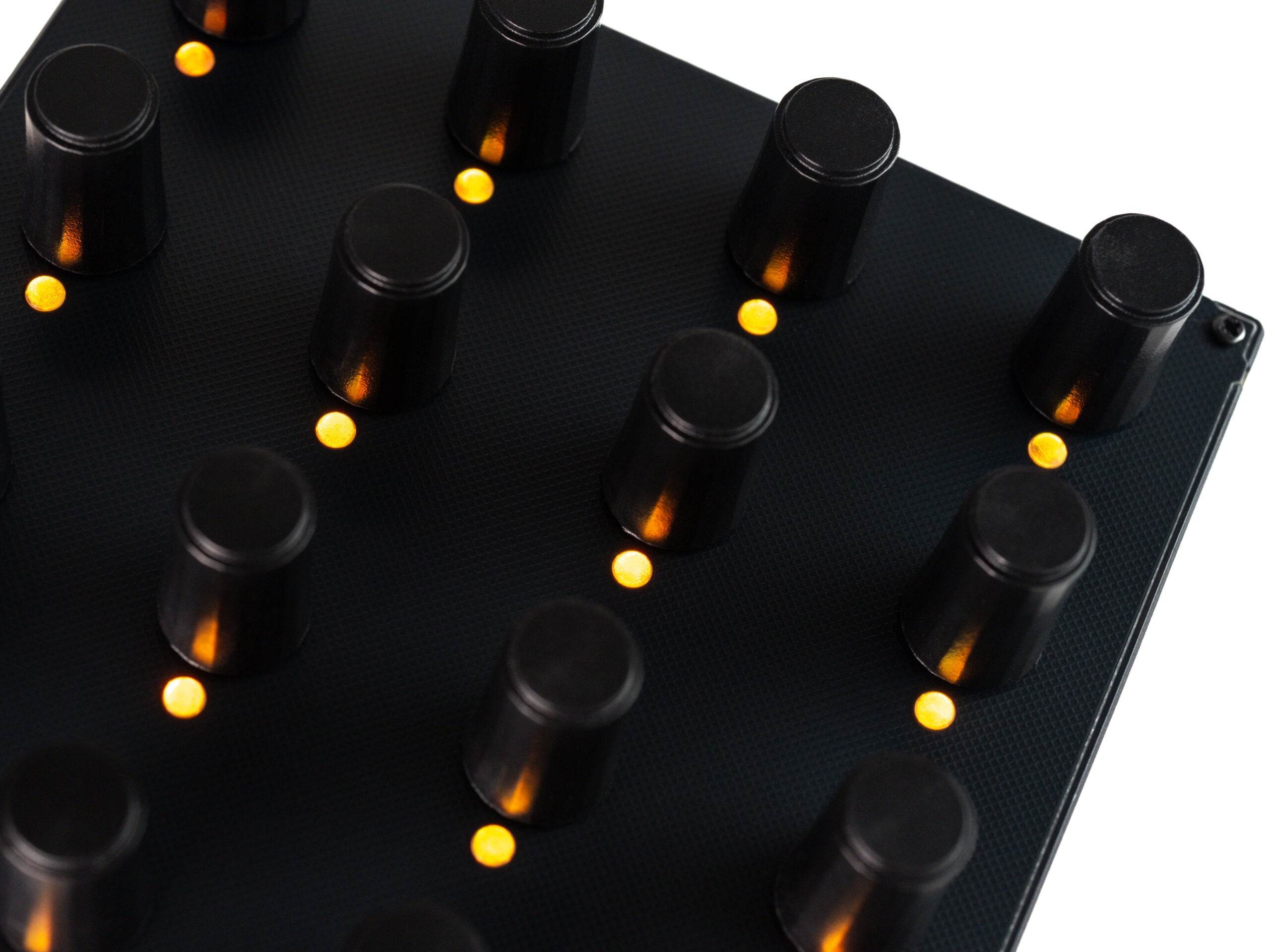 Close-up of Intech Studio EN16 Detent Series 3 MIDI Controller with detailed knob and button layout.