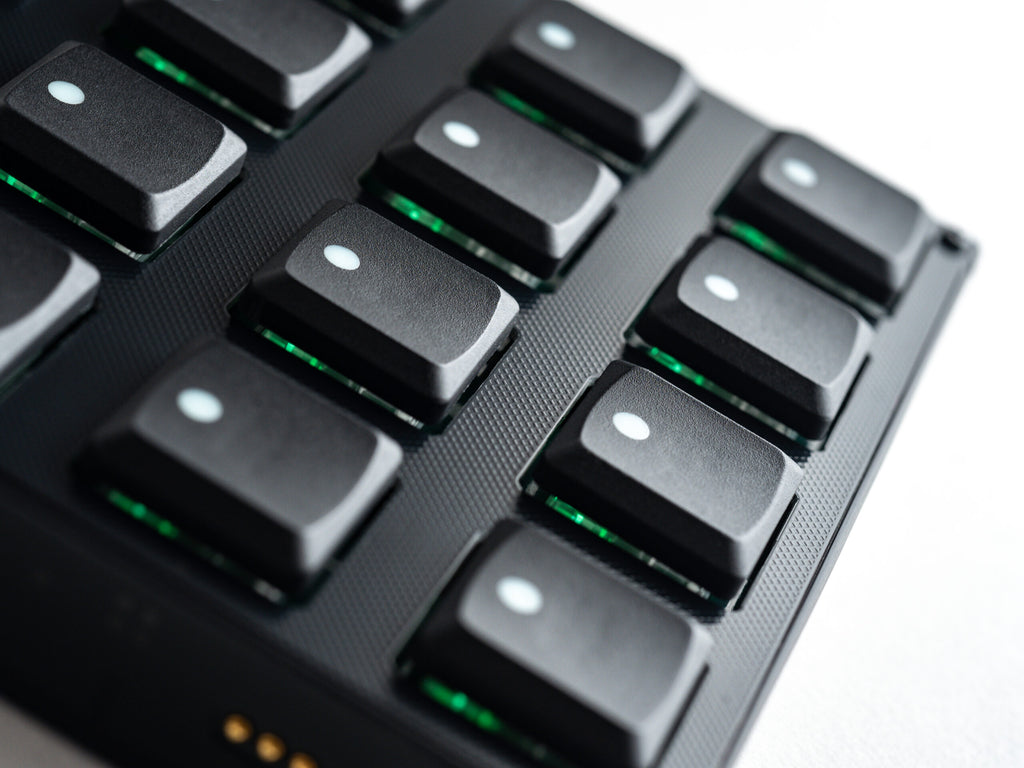 Close-up of Intech Studio BU16 Series 3 MIDI controller with knobs and buttons for music production.