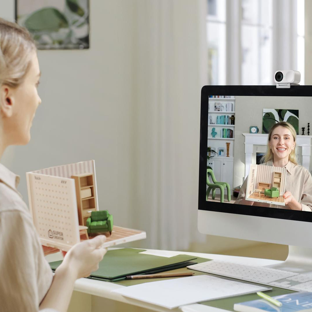 Insta360 Link 2C Standard video conferencing camera with adjustable lens and built-in microphone, designed for professional virtual meetings.