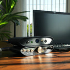 iFi Audio ZEN Air Blue 2 Bluetooth and Wi-Fi audio receiver connected to a home audio system, showcasing compact design and controls