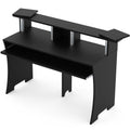 Glorious Studio Workbench, a sturdy black office desk with a spacious surface and modern design for creative workspaces.