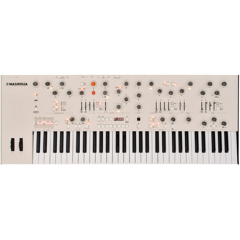 Frap Tools Magnolia keyboard synthesizer with sleek black design and multiple control knobs on a tabletop.