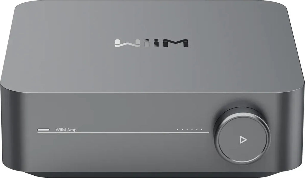 WiiM AMP music streamer device with sleek black design, compact form, and various ports for high-quality audio streaming.