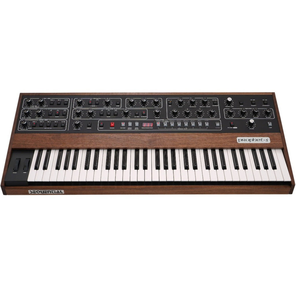 Sequential Prophet-5 synthesizer front view showing its keyboard, control knobs, and vintage design features.