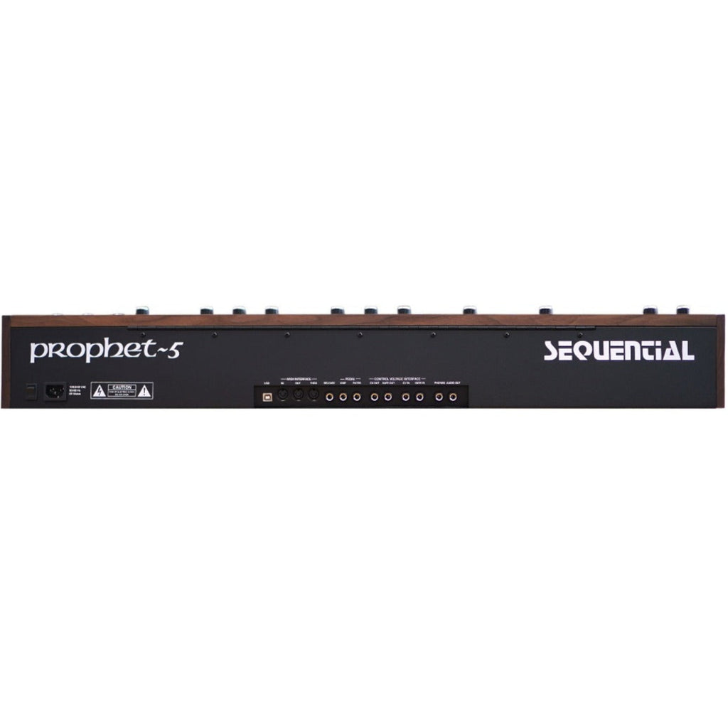 Sequential Prophet-5 synthesizer back panel showing control knobs, input/output jacks, and brand logo on a vintage-style instrument.