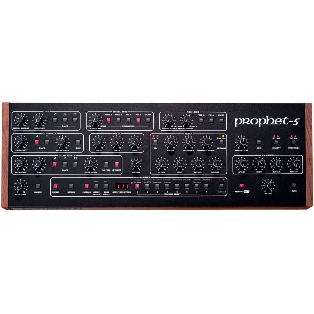 Sequential Prophet-5 desktop synthesizer with keyboard, featuring vintage-style control panel and silver finish.