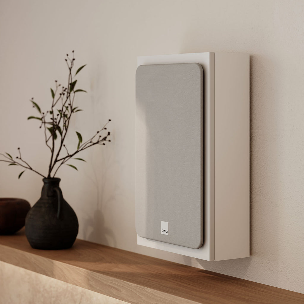 DALI Sonik On-Wall in-wall and outdoor speaker with sleek black grille and modern design for home audio systems