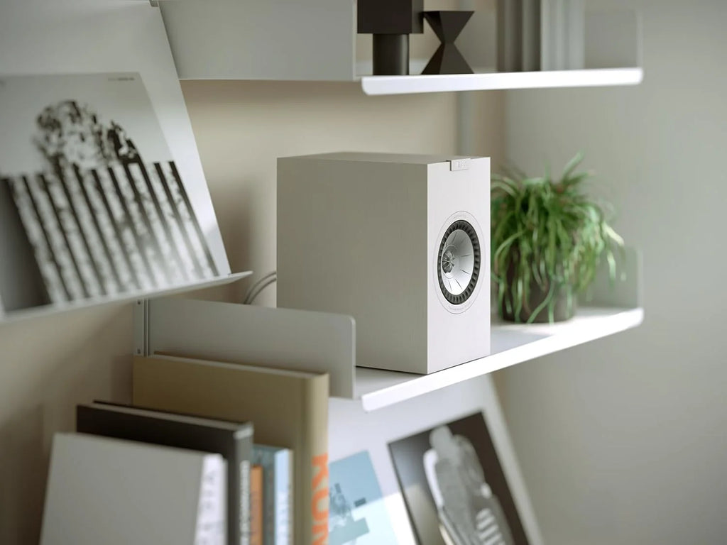 KEF Q1 Meta passive bookshelf speakers shown in black with sleek design and compact size, ideal for home audio systems.