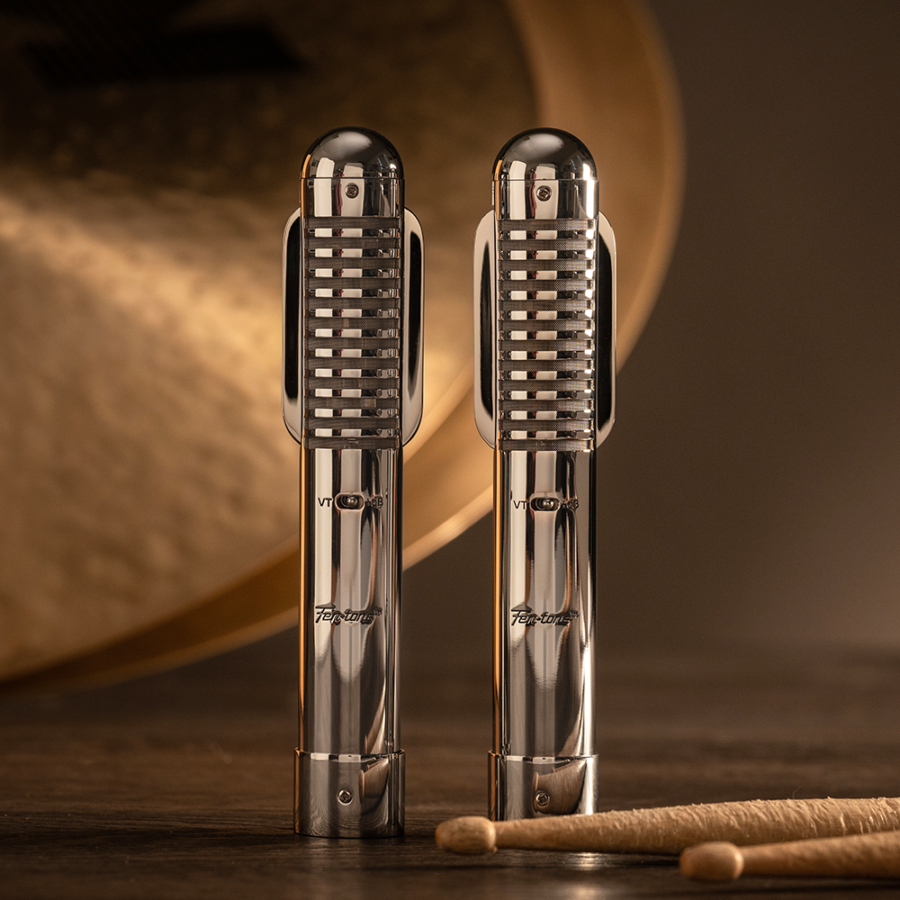 Pair of Warm Audio Fen-tone ribbon microphones, stereo set with sleek metal bodies and vintage-style design, ideal for studio recording.