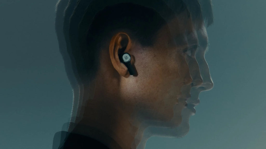 Wireless in-ear headphones from Bang & Olufsen Beoplay Eleven with sleek design and ear tips, shown on a neutral background.