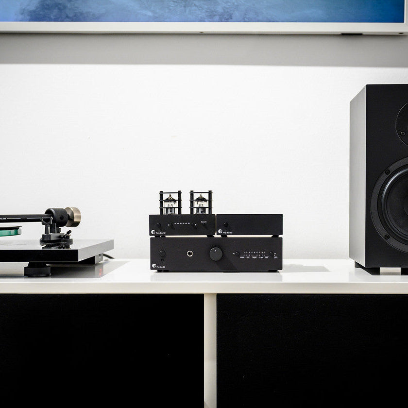 Pro-Ject Pre Box S3 stereo amplifier with silver finish and input controls, compact audio device for high-quality sound.