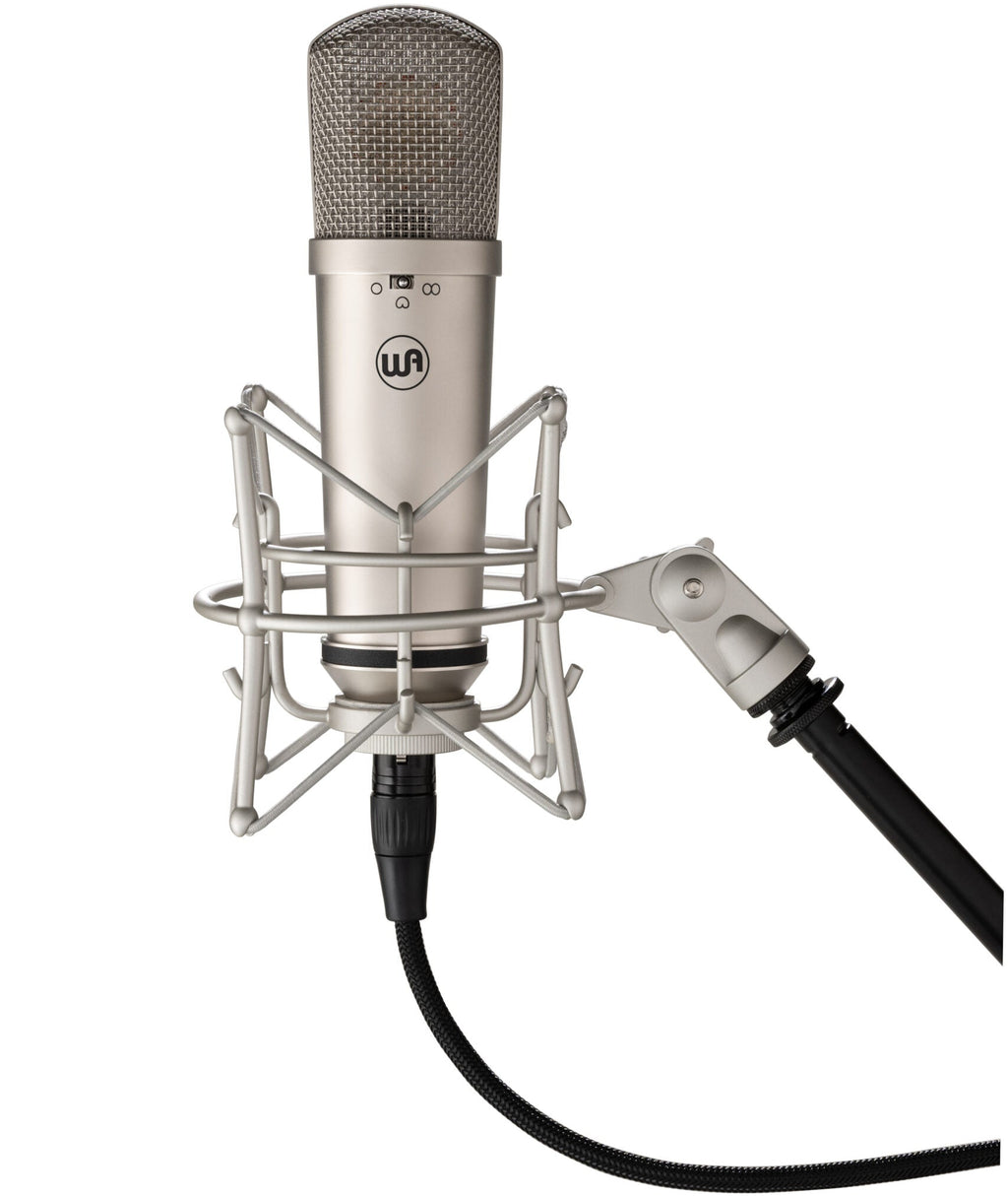 Warm Audio WA-87jr condenser microphone with nickel finish mounted on a shock mount, showing its professional studio recording setup.