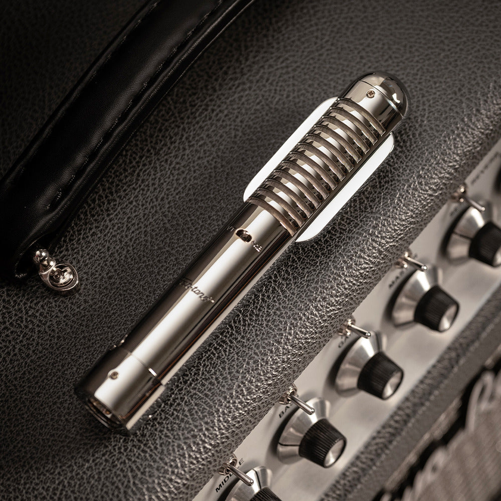 Warm Audio Fen-tone ribbon microphone shown from the side with its vintage-inspired design and grille details.