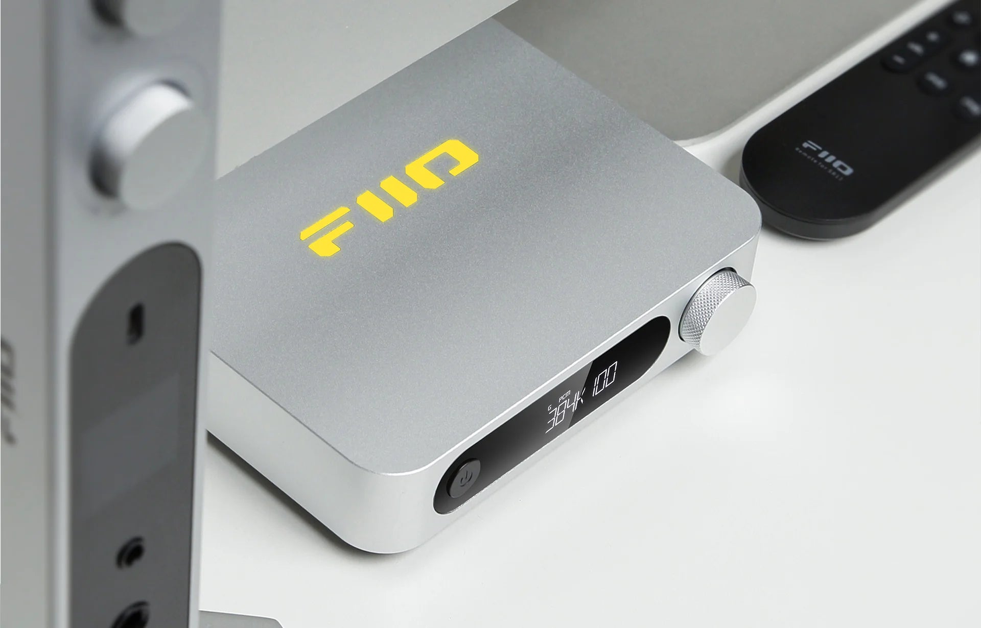 FiiO SR11 music streamer device with sleek black design and control buttons, designed for high-quality audio streaming.