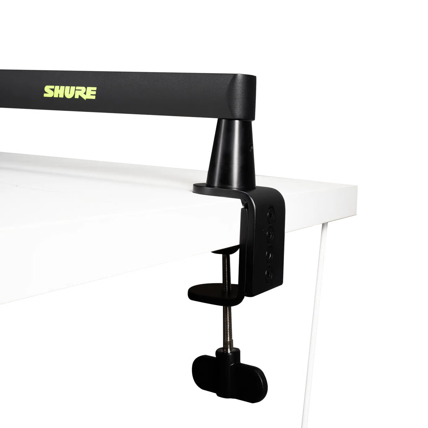 Shure SH-BROADCAST2 broadcast microphone arm mounted on a desk, adjustable with sleek metal design and cable management features.