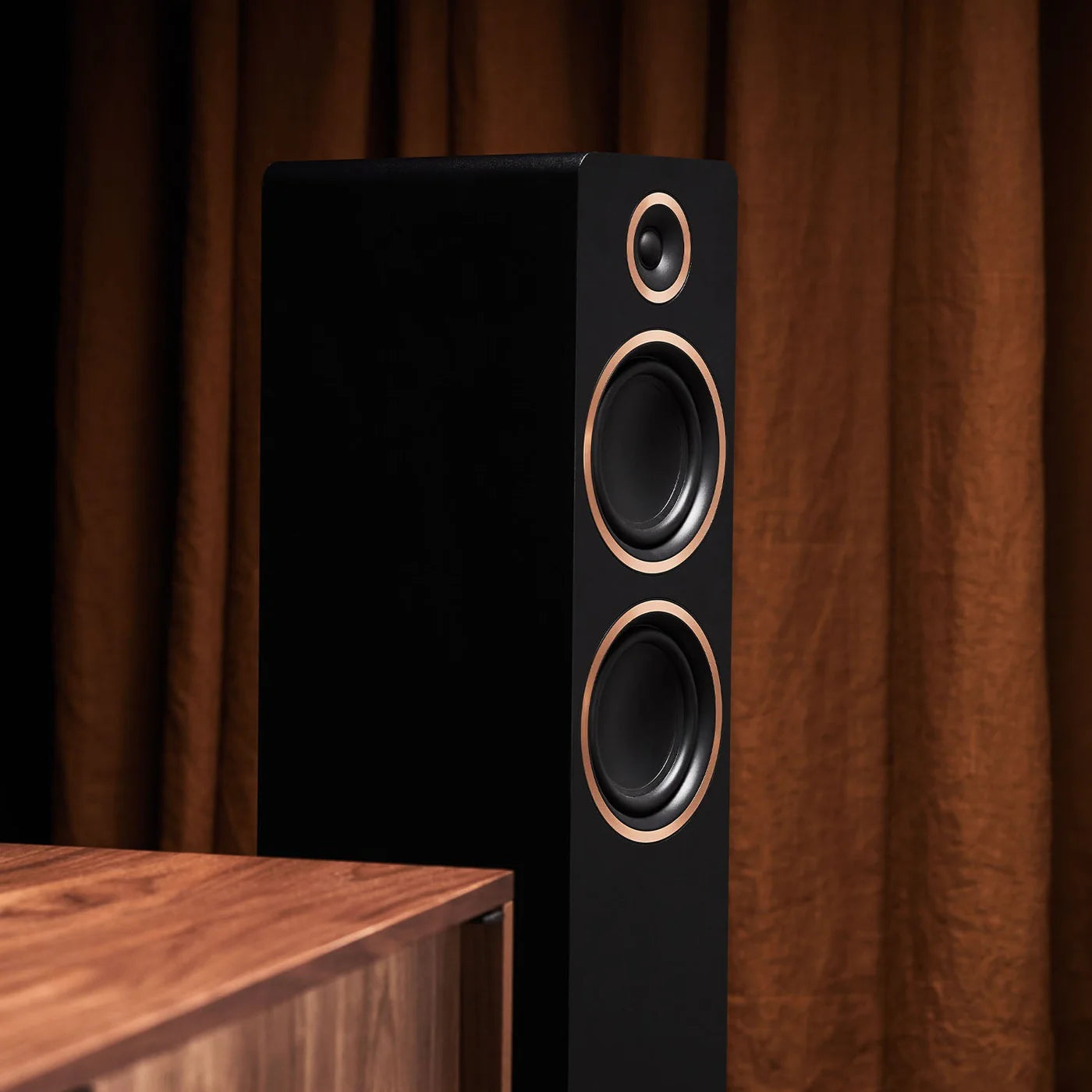 Black Argon Audio Fenris A55 floorstanding speakers with sleek design and multiple drivers for high-quality sound.
