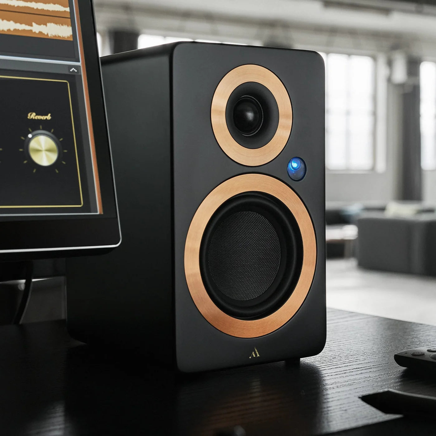 Argon Audio Forte A4 MK2 active bookshelf speakers in black with wooden finish, showing the front grille and control panel.