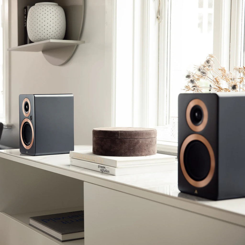 Argon Audio Forte A4 MK2 active bookshelf speakers shown from the left, black finish, with speaker grille and control panel visible.
