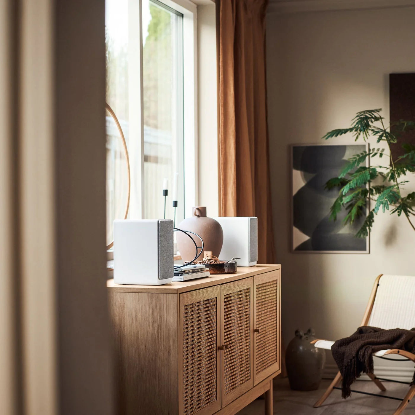 Argon Audio Forte A5 WiFi active bookshelf speakers with white finish, featuring sleek design and speaker grille, connected to audio equipment.