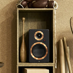 Black Argon Audio Forte A5 MK2 active bookshelf speakers with sleek design and fabric grille, placed on a wooden surface.