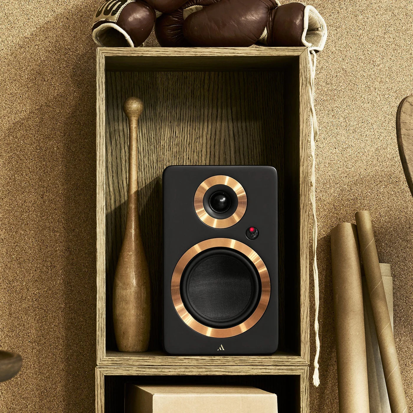 Black Argon Audio Forte A5 MK2 active bookshelf speakers with sleek design and fabric grille, placed on a wooden surface.