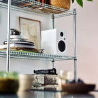 Argon Audio Forte A5 MK2 active bookshelf speakers with white finish and front-facing drivers on a wooden surface.
