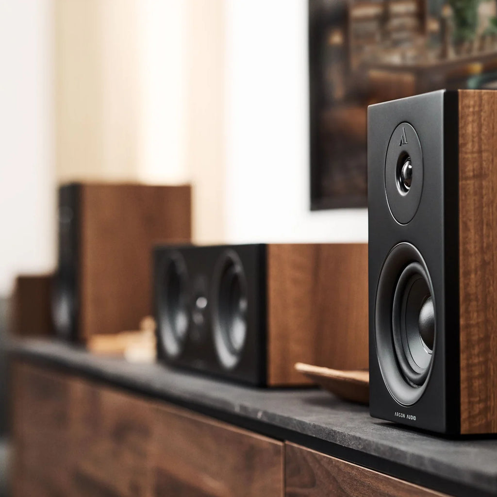 Argon Audio Forus 4 passive bookshelf speakers with wooden finish and sleek design, shown from the front angle.